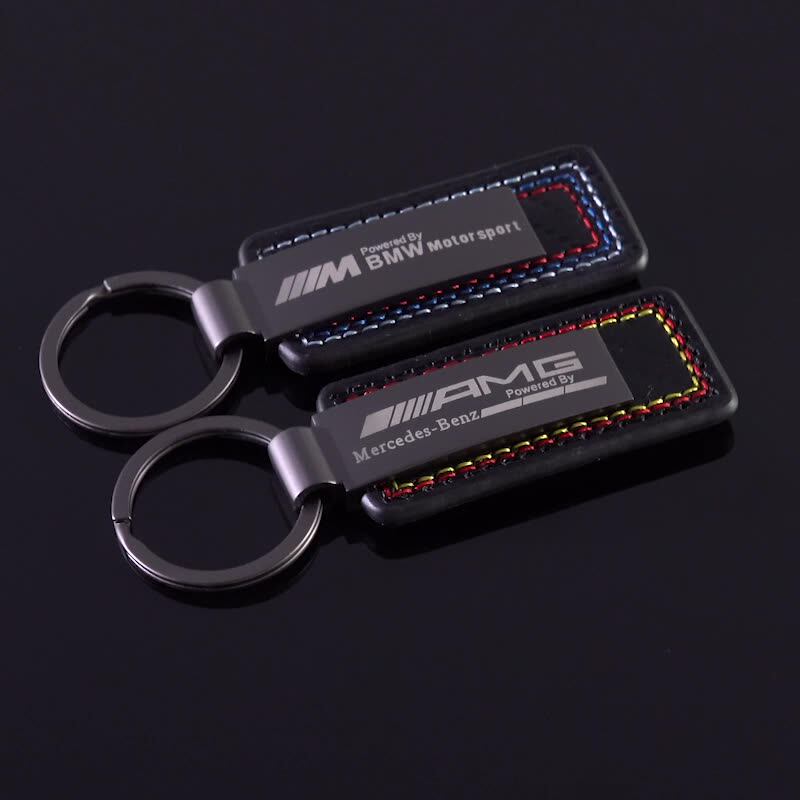 Mercedes-AMG and BMW M Motorsport leather keychain pair with racing contrast stitching