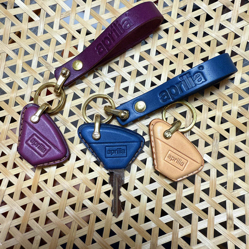 Aprilia RS457 leather key case and lanyard set with brass ring