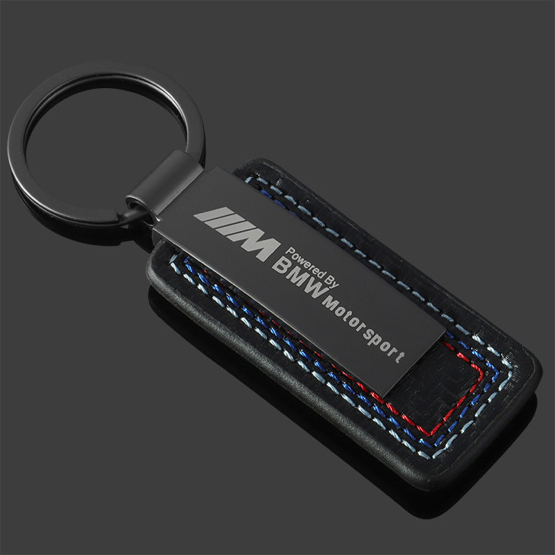 Mercedes-AMG and BMW M Motorsport leather keychain on white background