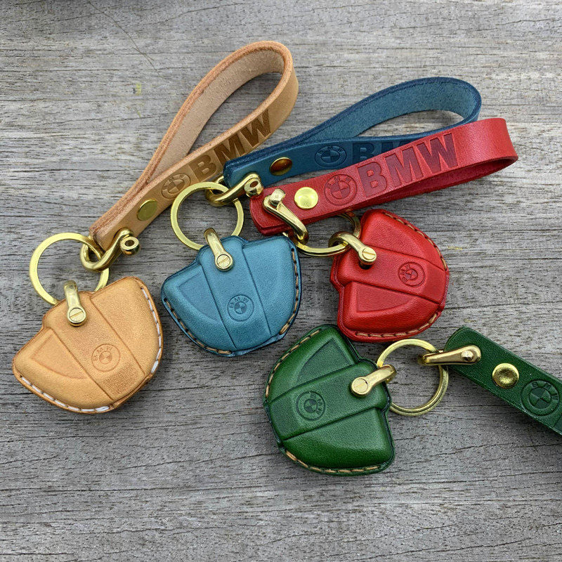 Handmade leather key case for BMW Motorrad in tan, blue, red and green with brass lanyard