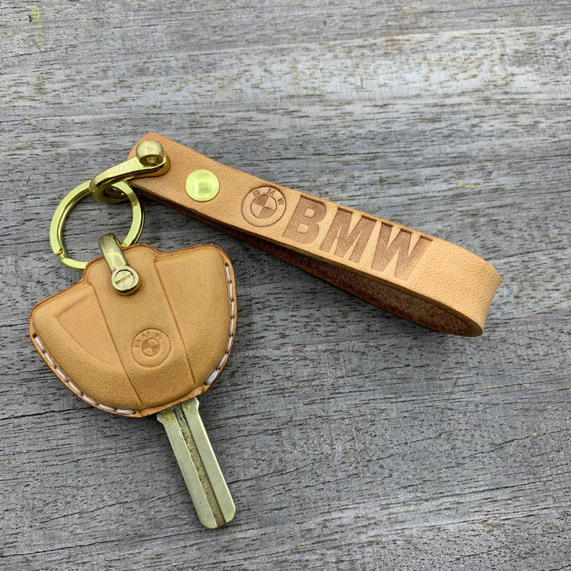 BMW Motorrad leather key cover with logo cutout showing BMW roundel