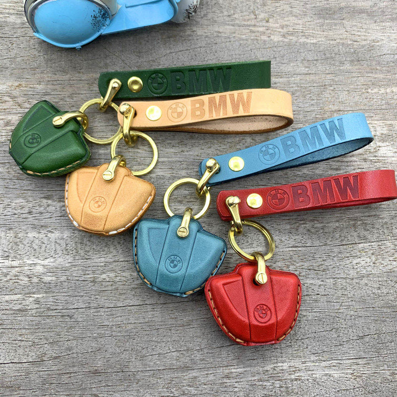 BMW Motorrad leather key cover with logo cutout showing BMW roundel