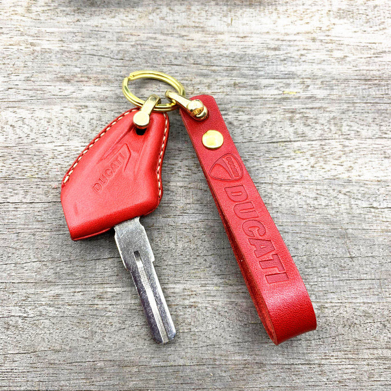 Handmade leather key case for Ducati Scrambler 800 in red with brass horse-shoe clasp