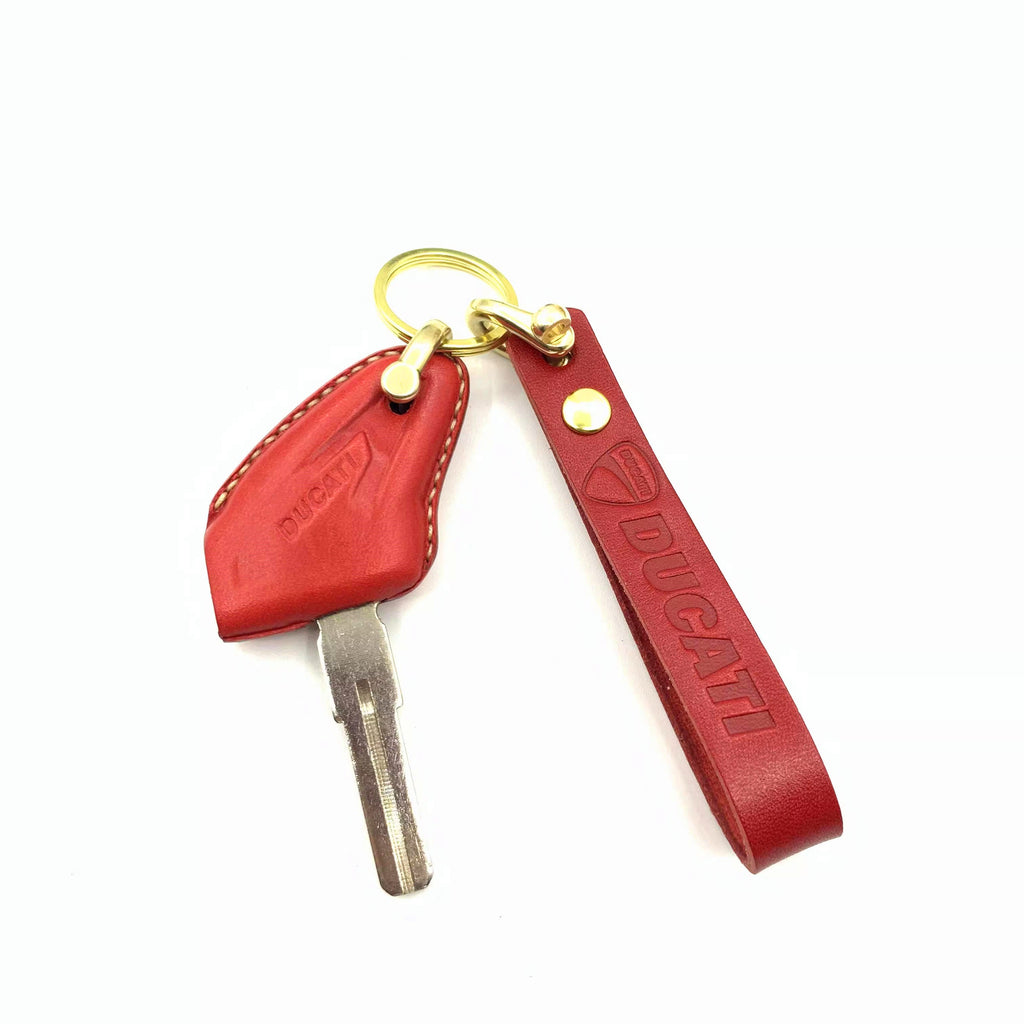 Handmade leather key case for Ducati Scrambler 800 in red with brass horse-shoe clasp