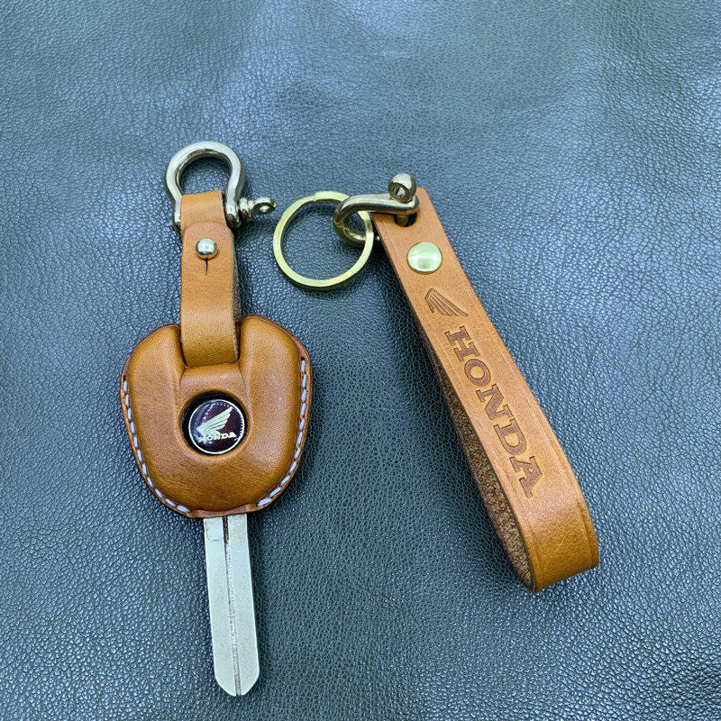 Honda CBR650 handmade leather key cover in orange with brass lanyard