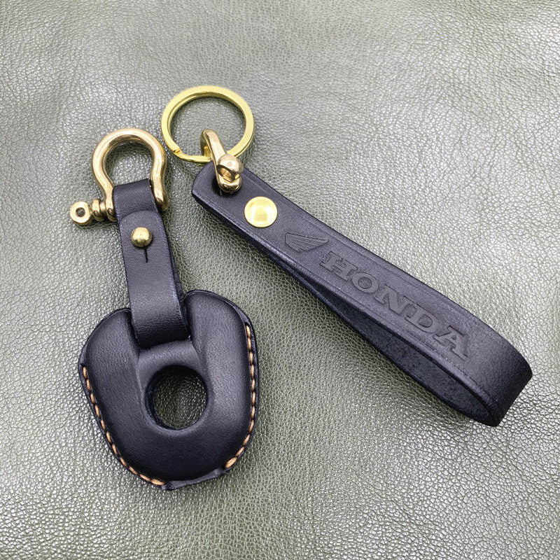 Honda NC750 leather key case comparison between logo cutout and solid cover versions