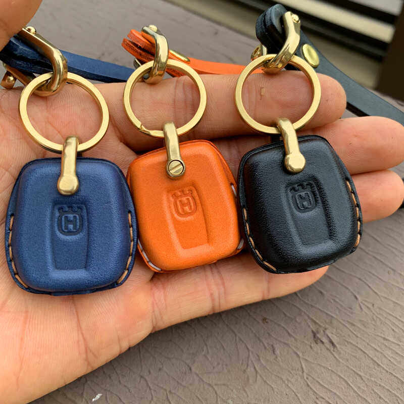 Close-up of Italian full-grain cowhide stitching on Husqvarna 401 key case