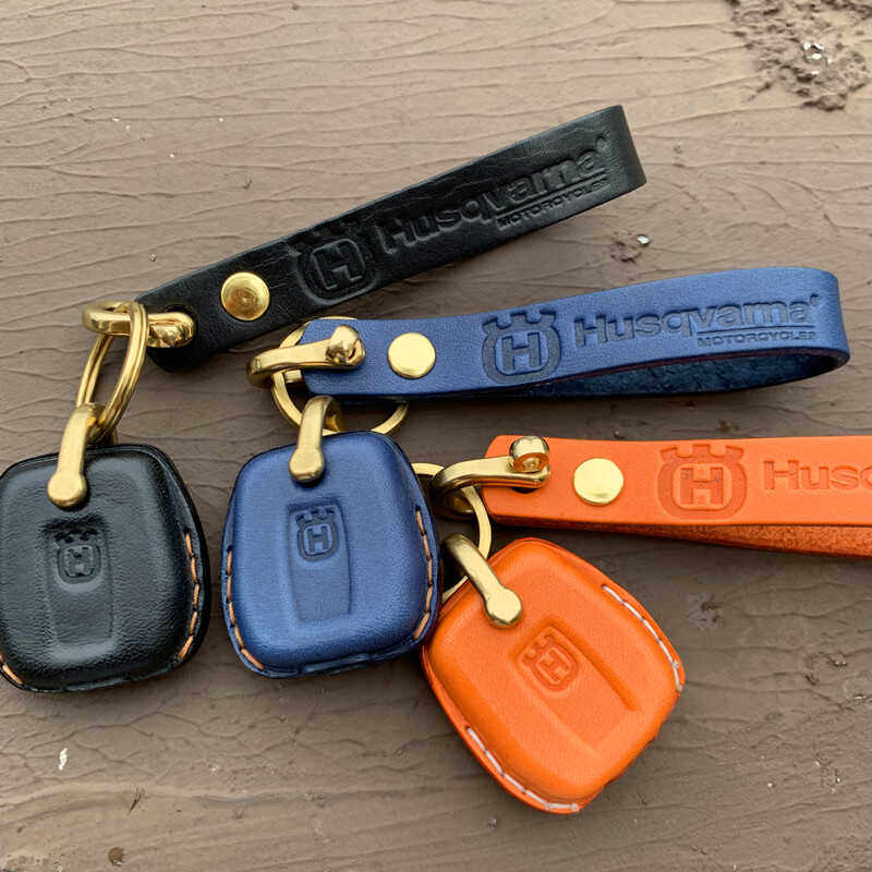 Handmade leather key case for Husqvarna Vitpilen and Svartpilen 401 in navy, orange and black