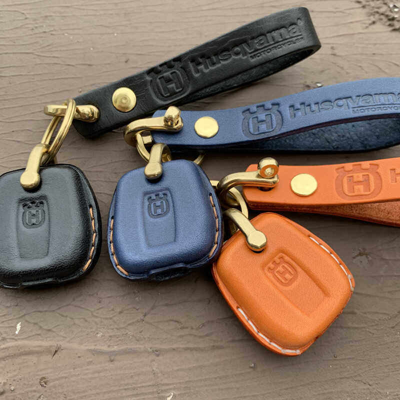 Husqvarna Svartpilen Vitpilen leather key case with brass hardware and lanyard