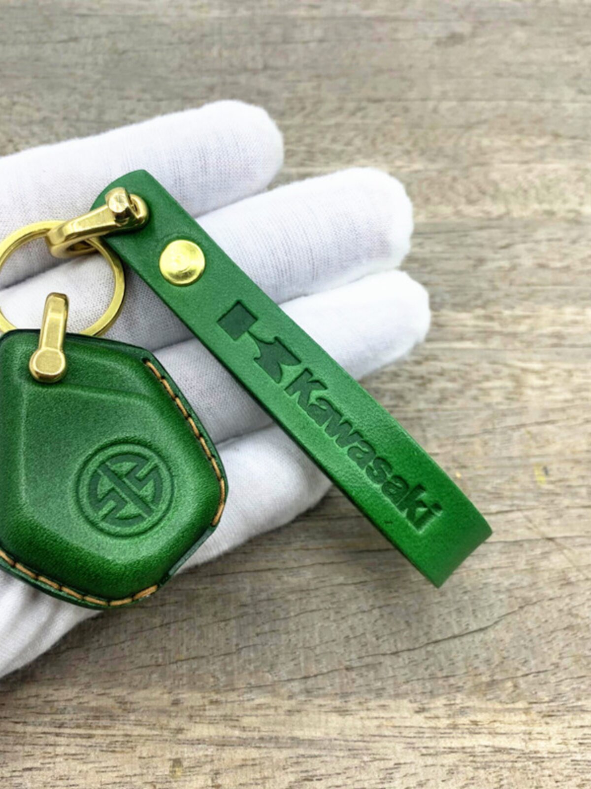 Close-up of vegetable-tanned cowhide on Kawasaki H2 leather key cover in green