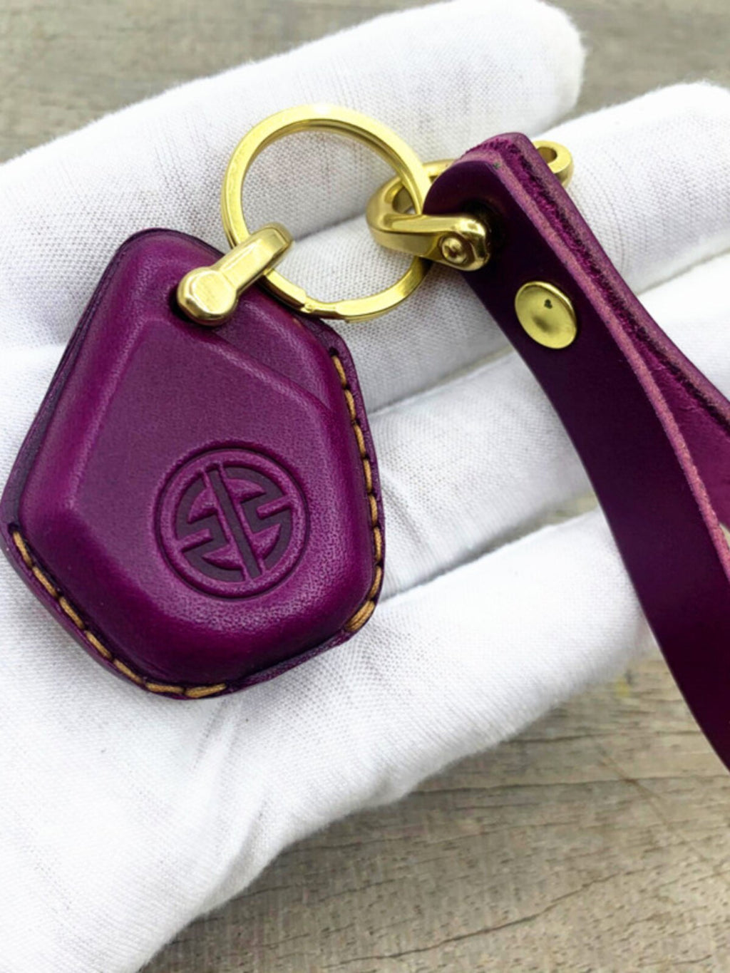 Kawasaki H2R handmade leather key case in purple with brass horse-shoe clasp