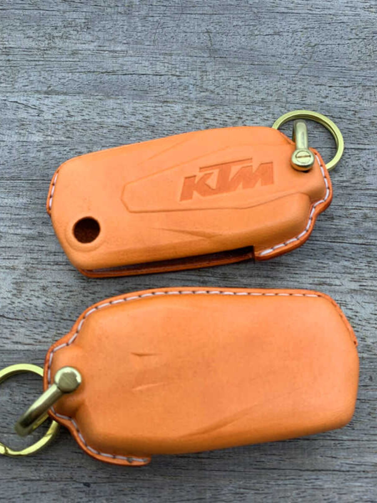 Handmade leather key case for KTM 1290 Adventure Super 2021 in orange with brass hardware