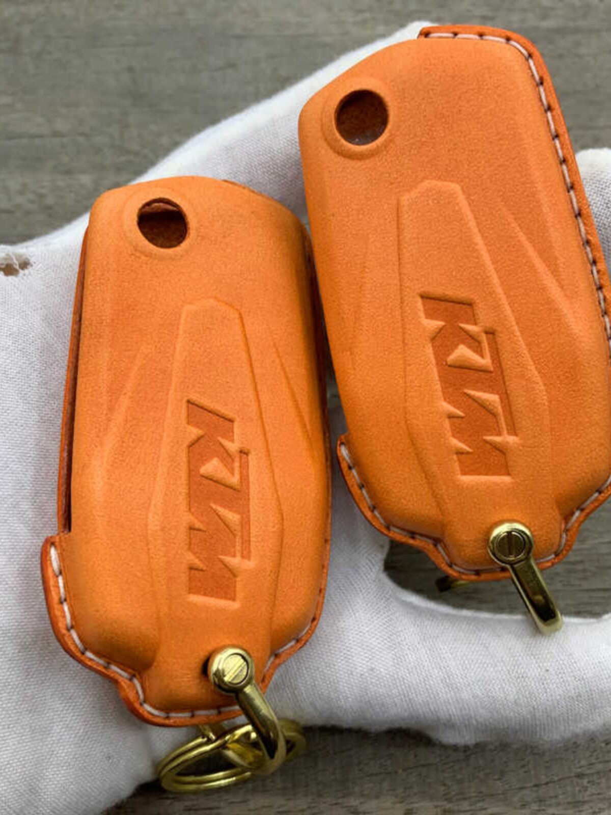 Handmade leather key case for KTM 1290 Adventure Super 2021 in orange with brass hardware
