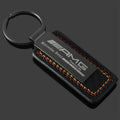 Mercedes-AMG and BMW M Motorsport leather keychain on black background