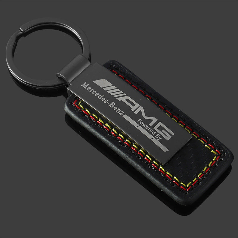 Mercedes-AMG and BMW M Motorsport leather keychain on black background