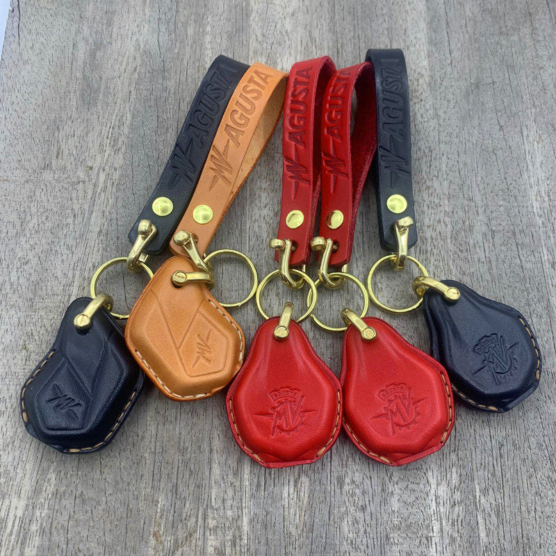 Handmade leather key case for MV Agusta in black, red and tan with brass hardware