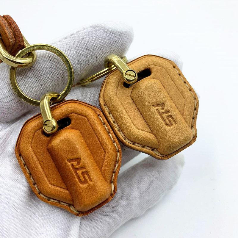 Handmade leather key case and lanyard for SYM Stalker and Mio 125 in natural tan with brass hardware